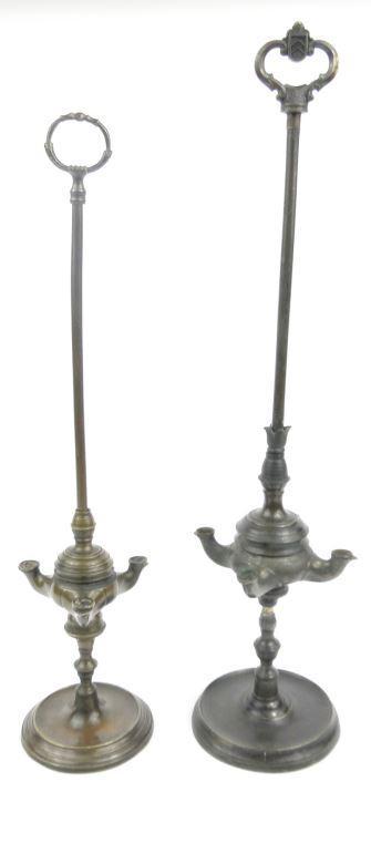 Two Islamic/Persian bronze oil lamps 56cm high : FOR CONDITION REPORTS AND TO BID LIVE VISIT WWW.