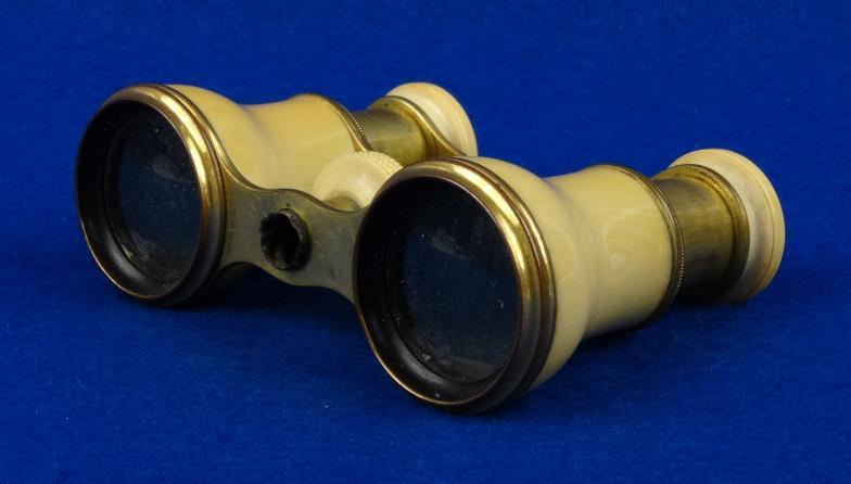 Pair of Curvilinear brass opera glasses with ivorine mounts, 9cm in length : For Condition Reports