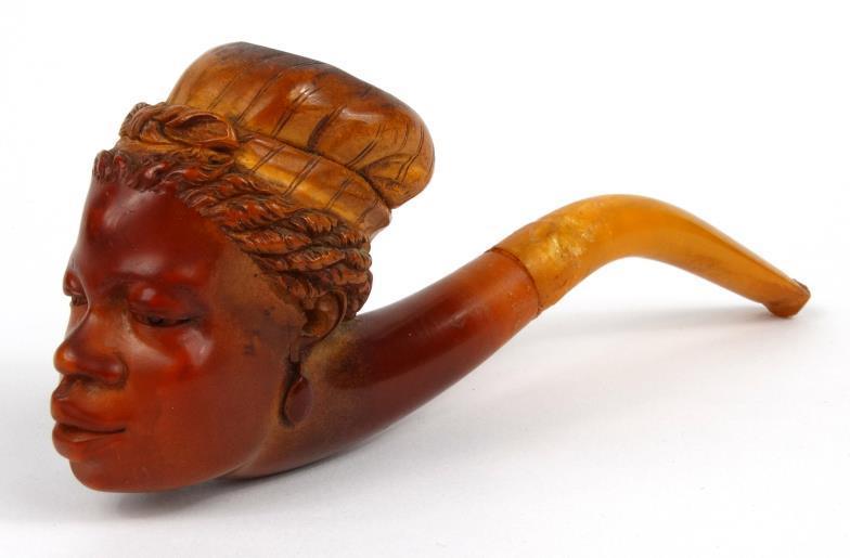 Meerschaum type bowl, the bowl well carved with an African female bust, with amber coloured