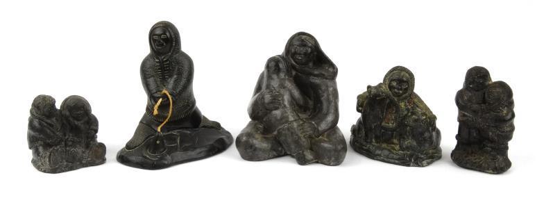 Five Canadian carved stone Inuit sculptures including Wolf and Aardvark examples, some bearing