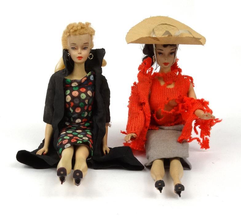 Two vintage Barbie dolls with original costume - one with spotted dress, the other with pony tail,