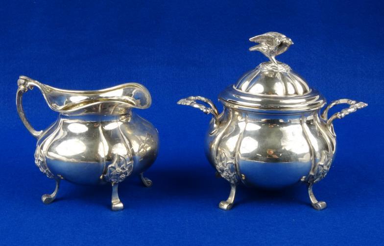 Danish silver sugar bowl and cover and matching cream jug, the sugar bowl lid with bird and nest