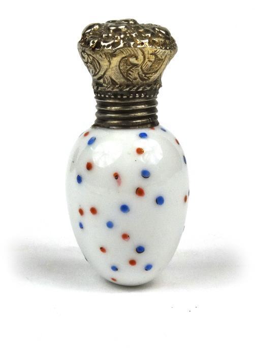 Novelty Victorian white glass scent bottle of egg form, with enamelled decoration and silver cap