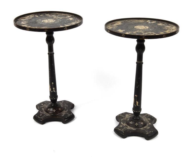 Pair of oriental black lacquered wine tables, the dish tops profusely inlaid with mother of pearl
