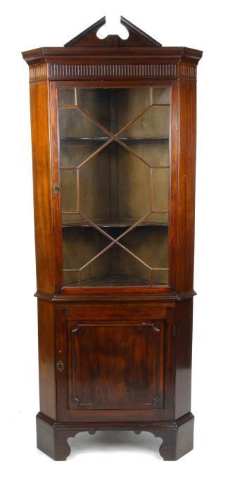 19th Century mahogany corner cabinet, the broken arch pediment above a moulded cornice, astragal