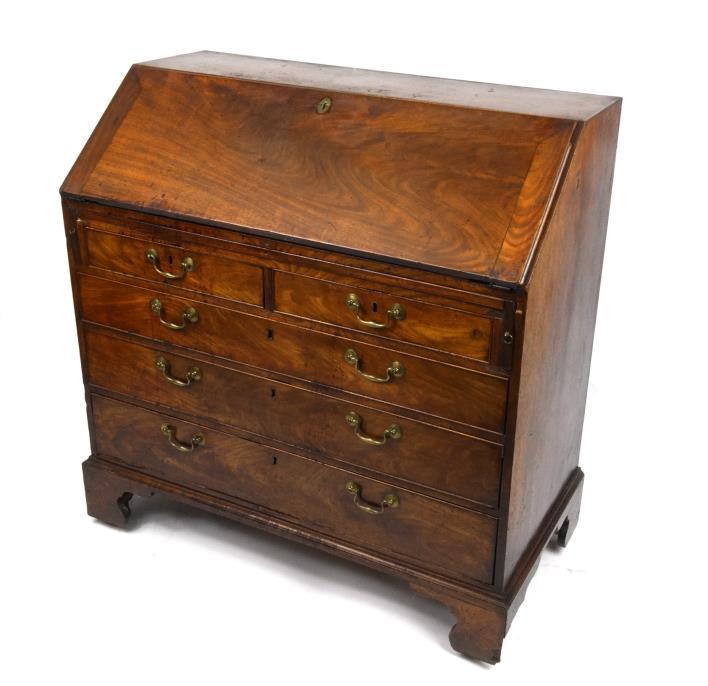 Georgian mahogany bureau, the fall enclosing a series of pigeonholes and drawers flanking a central