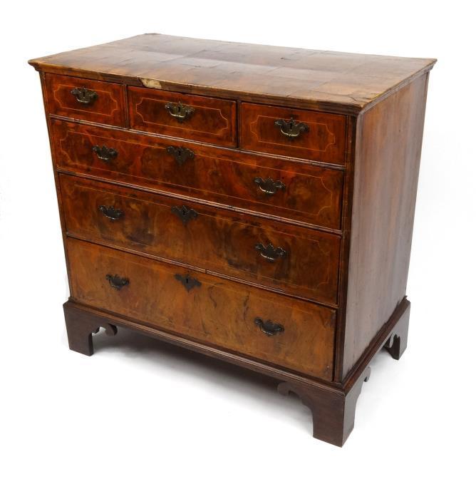 19th Century Queen Anne style burr walnut chest, the rectangular top above three short and three