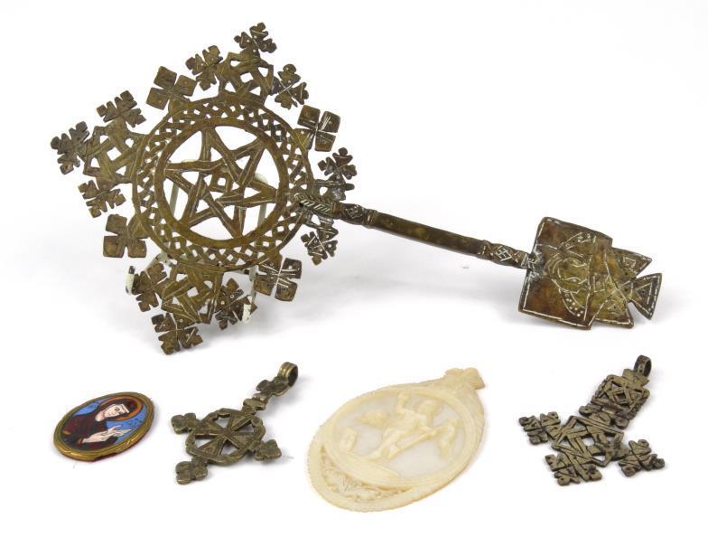 Collection of religious objects including a carved mother of pearl panel and enamelled miniature,