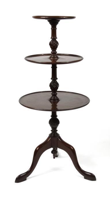 Edwardian three tier mahogany torchère, each of the dish topped graduated tiers with turned