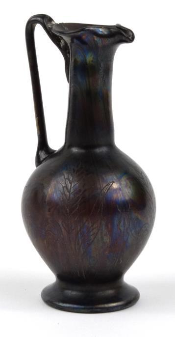 Roman style iridescent amethyst glass jug with engraved decoration, 16cm high : For Condition