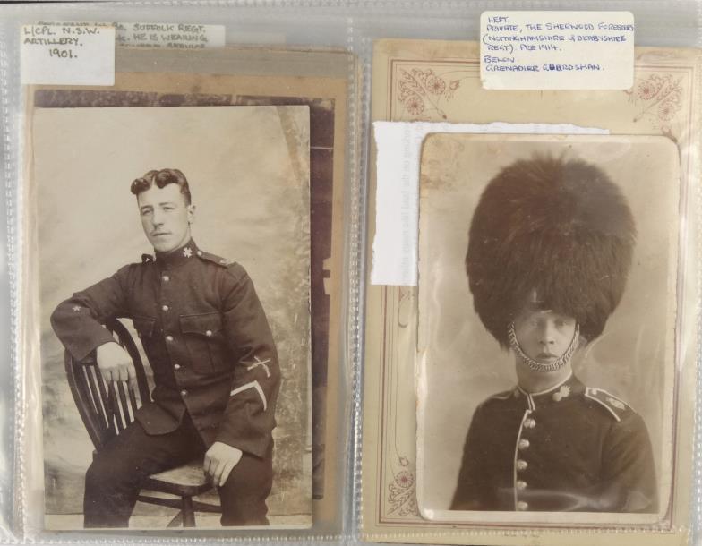 Album containing predominantly military interest postcards, photographs and printed ephemera