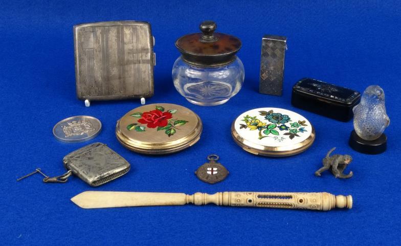 Objects including a silver cigarette case, glass bird shaped scent bottle, Georgian papier maché