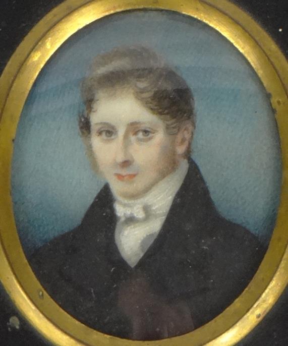 Early 19th century oval portrait miniature of a gentleman housed in an ebonised and gilt metal