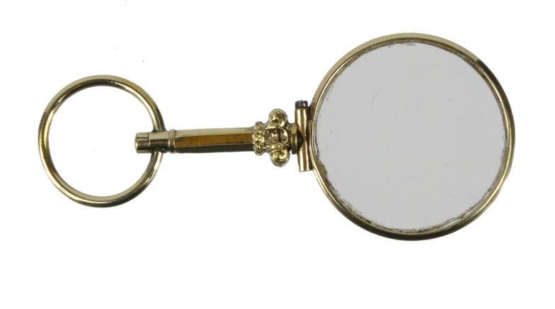 Late 19th century gold coloured metal magnifying glass with suspension loop, 7cm in length : For