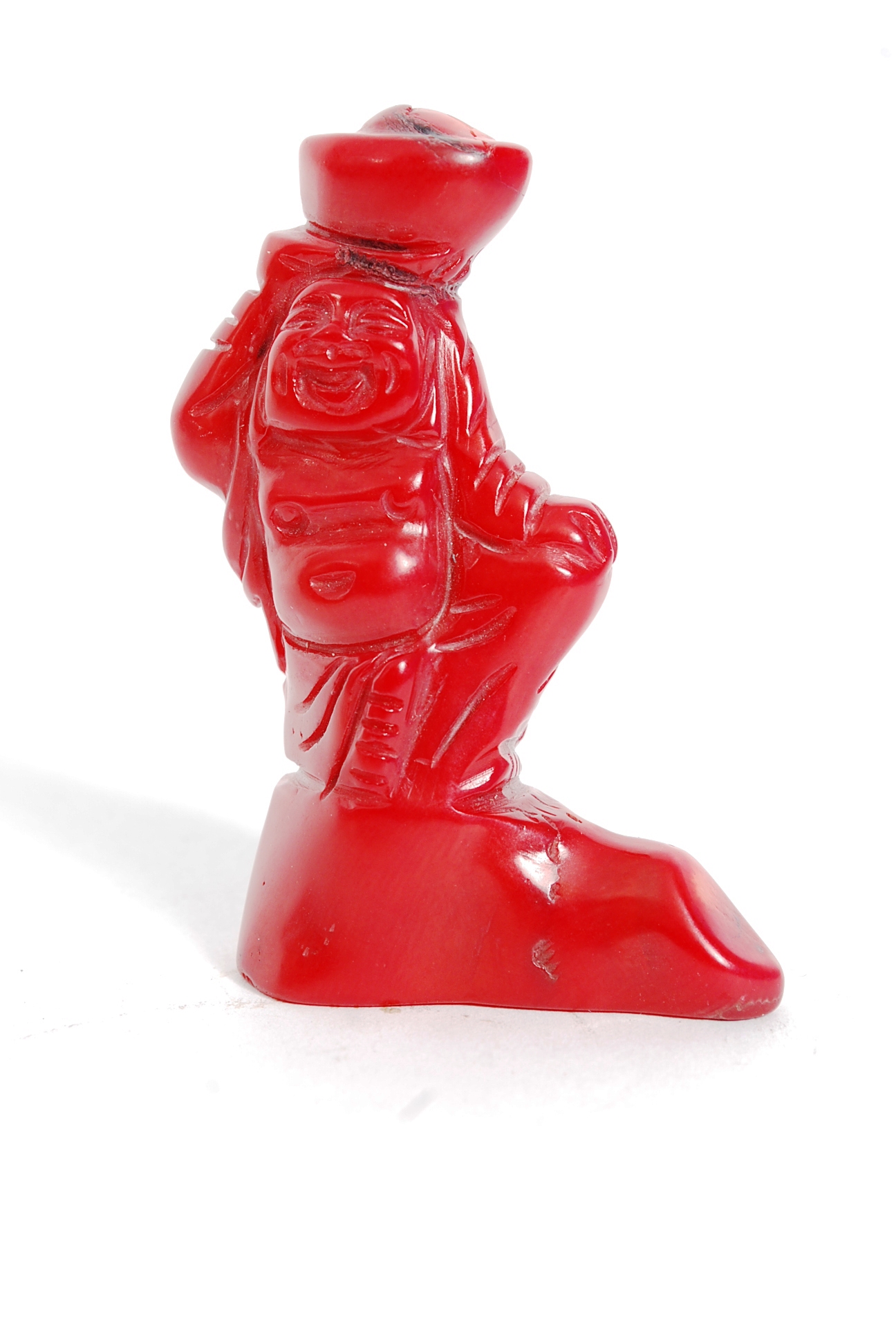 A Chinese red coral carved figure of Hotei, 7cm high