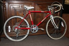 A retro 1980`s Emmelle 5 speed childs racing bicycle / bike in red with drip handles and whitewall