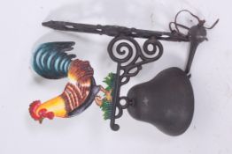 A large 20th century exterior cast iron wall hanging bell, with a hand painted cockerell to top.