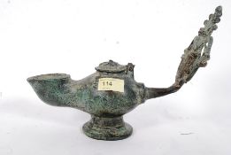 CHINESE BRONZE OIL LAMP WITH DECORATIVE HANDLE Chinese bronze oil lamp with reticulated design on