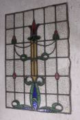 A good stained and leaded glass window panel dating to the early 20th century having Art Nouveau