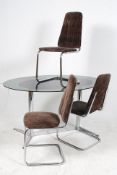 A good 1970`s chrome and glass dining table together with 3 fabric upholstered diner style chairs (