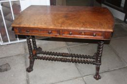 An early Victorian burr walnut writing table desk, Fitted with twin frieze drawers being raised