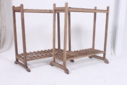 A pair of rustic early 20th century stick stands having squared supports with sectional twin tiers,