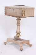 A  19th century Regency painted teapoy. Raised on a quadruped base with shaped column having