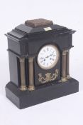 A good 19th century slate mantel clock having brass corinthium columns either side of the enamel