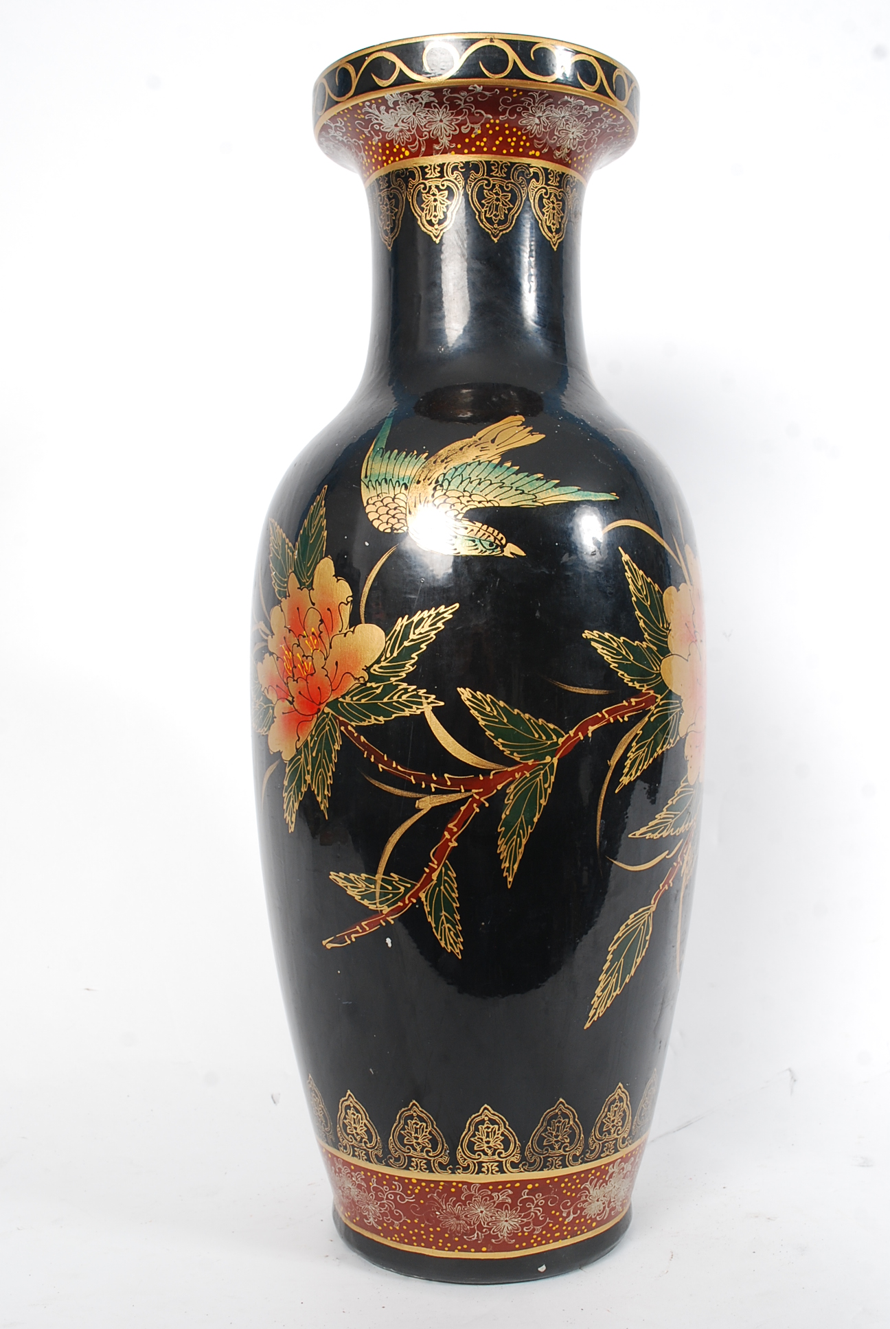 A large floor standing Chinese oriental vase depicting birds of paradise and floral scenes.