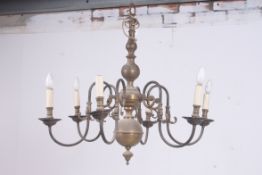 A good early 20th century large brass rococo chanderlier having bulbous centre with 6 branches