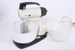 A vintage 1950`s  / 1960`s Sunbeam food mixer and glass bowl together with accessories.  H33cm x
