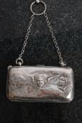 A 19th century continental silver purse ( tested) having winged cherubs in relief having fabric