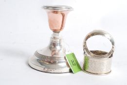 A silver hallmarked candlestick for Birmingham circa 1900's together with 3 silver hallmarked napkin