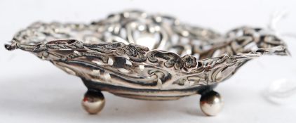 A silver hallmarked heart shaped trinket dish of rococo design with pierced surround. Hallmarks