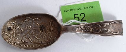 A silver hallmarked silver christening spoon decorated with floral motifs, the bowl of spoon