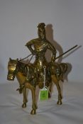 A decorative large Brass figurine of a seated warrior on horse complete with weapon
