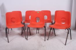 A set of Seven vintage retro 1970`s ``Hille`` Orange school chairs raised on ebonised tubular metal