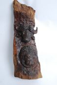 A 20th century carved wood totem depicting African animals