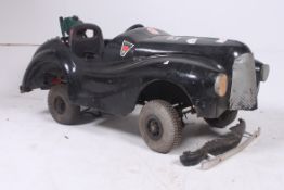 A rare and original 1940`s Austin J40 pedal car body, being mounted on a later chassis and fitted