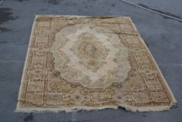 A large mid 20th century Belgian Arakstan wool rug of plain form having medallion to centre and