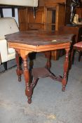 A Victorian occasional/ side table with scalloped top and under tray, turned legs.