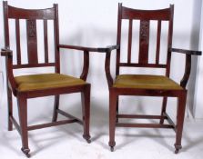 2 large 1920`s mahogany Arts & Crafts revival carver armchairs. Raised on squared legs with castors