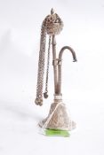 An Islamic / Iranian silver miniature hookah pipe with decorative scrollwork in relief having