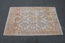 A 100% wool pine English carpet of pale form with original label to underside. Measures 245cms x