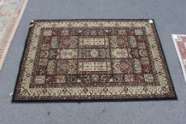 A good quality Persian rug having red background with black borders and geometric pagination.