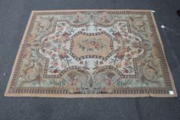 A large Chinese rug being 100% wool having deep pile being decorated with scolled design having