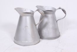 A pair of mid 20th century Industrial galvanised metal dairy milk jugs of large form with loop