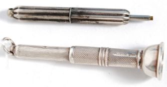 A hallmarked silver cigar pricker along with white metal propelling pencil.  Weight 16grams