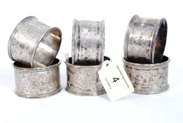 A set of 6 hallmarked silver rococo napkin holders with chased design bearing hallmarks for