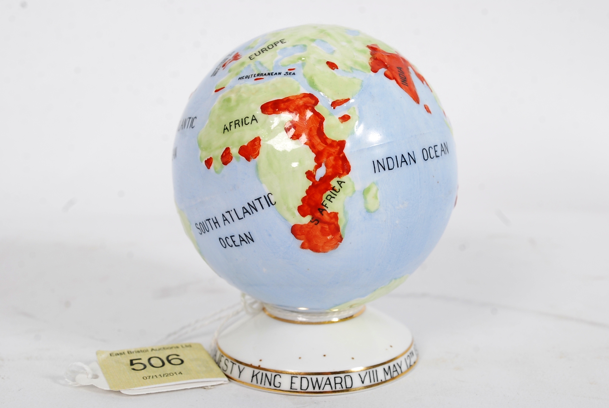 1937 Edward VIII: a colourful globe by Melba, the base inscribed around the foot, 90mm high